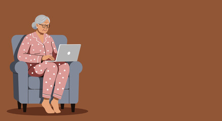 Happy senior woman in pajamas sits comfortably in an armchair, engaging with her laptop. Represents modern elderly, remote work, or online connection.