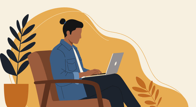 Young man focused on his laptop while sitting in a comfortable armchair at home. Ideal for concepts of remote work, productivity, and flexible lifestyle.