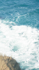 Vertical Ocean Wave Crashing on Rocky Cliff – Japanese Style Blue Tone Seascape Photo