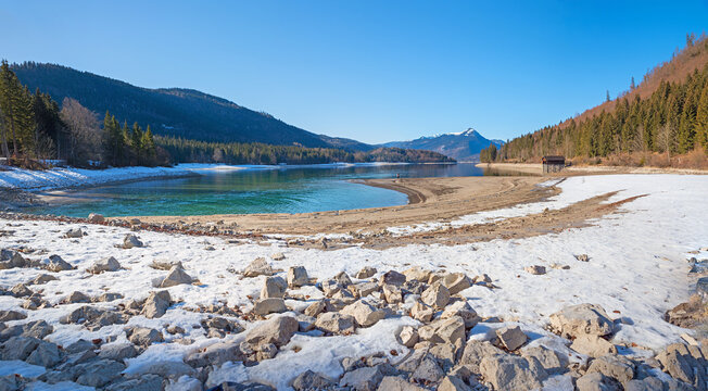 Lake Walchensee with low water level in a dry winter season, rocky shore. upper b avaria
