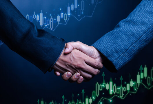 Business handshake based on financial stock market charts, partnership agreement, investment agreement, corporate success and trading cooperation concept symbolizing trust, teamwork, economic growth.