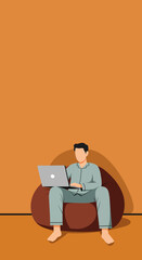 Man in pajamas working from home on a laptop, comfortably seated on a bean bag. Represents remote work, flexible lifestyle, and modern productivity.