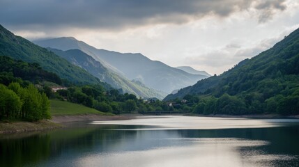 Serene mountain landscape featuring a reflective lake under natural ambient lighting.
