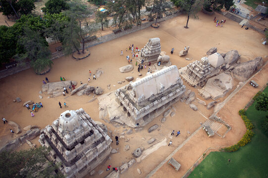 Mahabalipuram, India - 17 September 2006: Aerial view of the Pancha Rathas, ancient monolithic rock-cut temples, stand majestically amidst the sandy landscape.