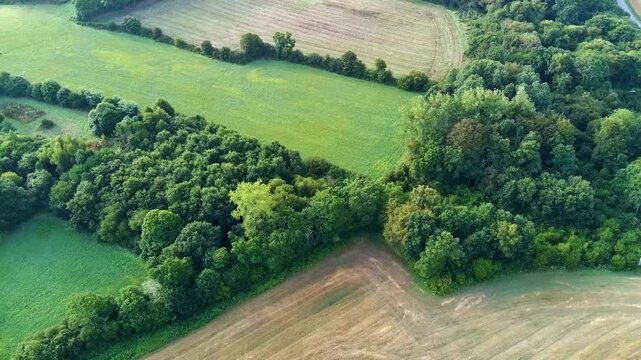 Aerial view on Brittany fields, hedgerows with straw bales and plowed fields
