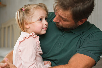 Happy Father Playing with Daughter. Three Years Baby Smiling, Laughing, Looking at Daddy. Man Showing Affection to Child. Candid Real Emotion. Beard Dad and Little Kid Girl. Authentic Family Lifestyle