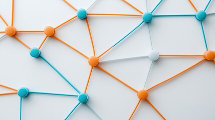 An intricate arrangement of orange and blue pins interconnects various nodes, highlighting a minimalist design against a clean white backdrop