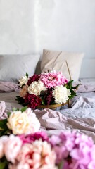 A bouquet of flowers on a bed