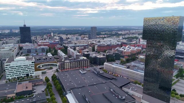 Kista, Sweden - 05 September 2025: Aerial view of Scandic Victoria Tower and of buildings and structures with contrasting textures, tones, and colors at Arne Beurlings Torg.
