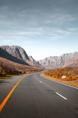 Winding mountain road through scenic valley