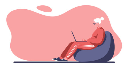 Elderly woman comfortably uses a laptop on a bean bag chair at home. Represents senior technology adoption, remote work, or relaxed online learning.