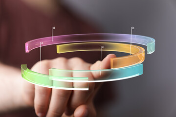 Close-up of a hand interacting with a colorful 3D data visualization.  Perfect for technology, business, and data analysis concepts.