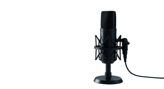 Three modern black studio condenser microphones, one sharp, two blurred, on sleek white desk with blurred headphones and laptop, professional digital audio concept