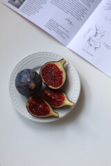 fresh figs on whire ceramic plate
