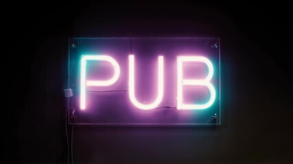 Neon pub sign glowing in purple and blue on black brick wall background. Illuminated bar signage for nightlife and entertainment concept. Retro style light display.
