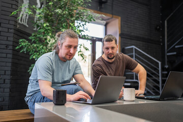 Business project team working together at meeting room at office. Programmers working in the office of a software development company. Coding technologies, site design