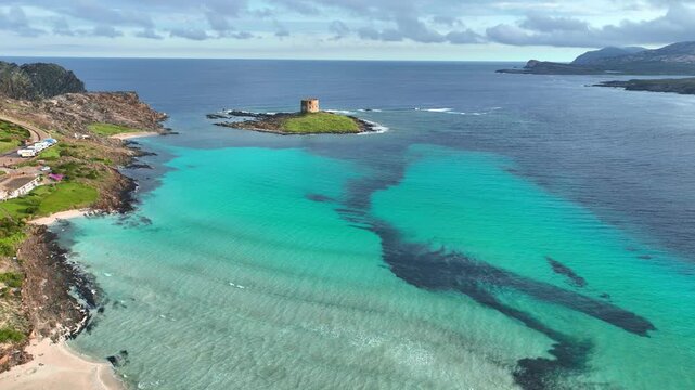 idyllic la Pelosa beach in Sardinia, Italy, idyllic Mediterranean coast drone shot, turquoise lagoon in east Sardinia, vacation in Italy