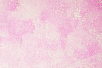 Pink abstract textured plaster wall background