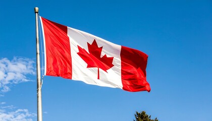 Canadian flag waving proudly against a vibrant blue sky on a sunny day