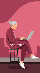 Active senior woman happily uses a laptop for online learning or staying connected, embodying modern digital literacy and an engaged lifestyle.