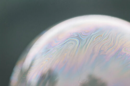 Close-up of a Soap Bubble Surface with Iridescent Swirls