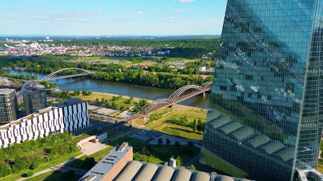 4K Aerial Drone Video of Tour Boat on the Main River Sailing Past the European Central Bank Building in Downtown Frankfurt, Germany