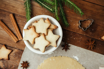 Festive cookie dough and baking setup on wooden table for christmas culinary and rustic food concept