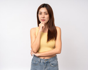 Beautiful young asian woman in yellow shirt. Charming female lady standing pose thinking on isolated white background. Asian woman cute people have idea with copy space.