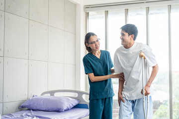 Obraz premium Physical therapy. Female Nurse aids young man in recovering from spine injury and providing orthopedic massage Orthopedic healthcare and chiropractor with person for physical therapy rehabilitation