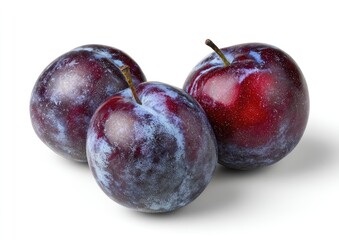 Fototapeta premium Three plump plums, deep purple and blue hues, sit close together on a white background. Visible stems connect them to the fruit
