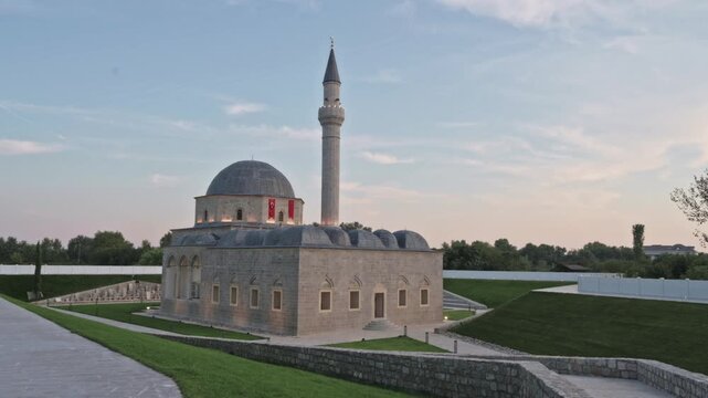 Exploring the architectural beauty of Xhamia e Plumbit in Shkodra, Albania at sunset
