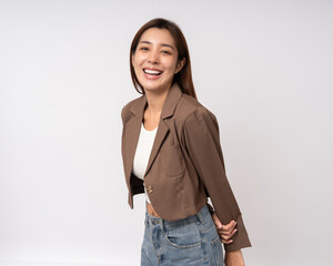 Attractive Young asian business fashion stylish woman smiling to camera standing pose on isolated white background. Latin Female around 25 wearing jacket suit portrait shot in studio. © Chanakon