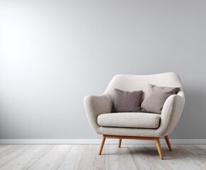 A neutral-toned, modern armchair sits against a light gray wall, casting a peaceful and minimalist aesthetic.