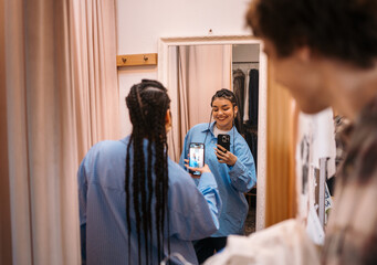Joyful Reflection Young Woman Taking a Fun Selfie in a Fitting Room Space