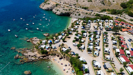 Campsite at Campig Skrila, Krk Island, Stara Baska Croatia, Aerial View of the Mountains and Coast With Boats, Beaches and Adriatic Sea. The Seaside Rv Campmobiles on a Summer Beautiful Coastline