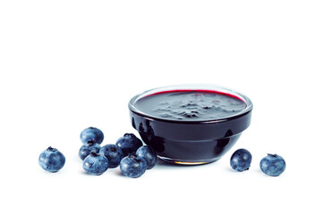Blueberry jam with berries isolated on white background.