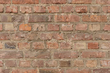 High-resolution image of a rustic red brick wall texture. Perfect for backgrounds, designs, and architectural projects.  Download now!