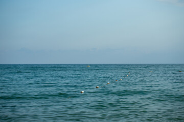 Ocean View with Buoys and Blue Sky
