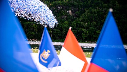 Colorful flags and scenic landscape create a vibrant national celebration backdrop