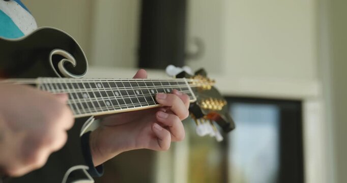 Caucasian Kid Play Mandolin at Home. European Boy Practice Music 4K 10-bit