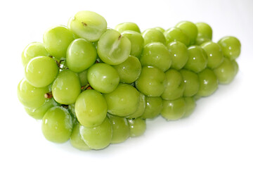 Fresh Bunches of shine muscat grapes green fresh grapes isolated on white background. Japanese grapes ripe juicy grapes.
