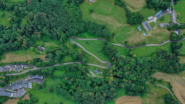 Serpentine Country Road Through Lush Green Landscape