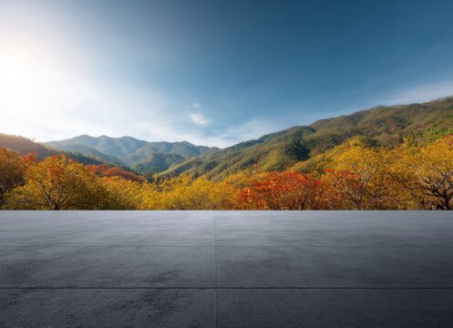 Featuring an empty concrete floor set against a vibrant, colorful autumn forest, creating an ideal backdrop for product placement and presentation - Powered by Adobe