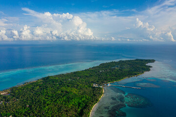 Aerial view of a tropical island with turquoise waters