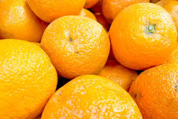 Oranges in basket at grocery store, fruits and vegetables are sold at market