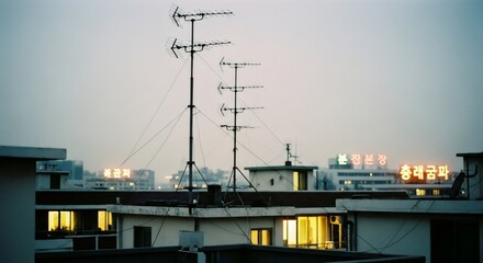 Urban rooftop view with tv antennas at dusk. Nostalgic 80s-90s cityscape. Melancholic vibe of apartment buildings. Retro photography for social media post or blog header.