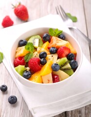 Colorful fruit salad in bowl