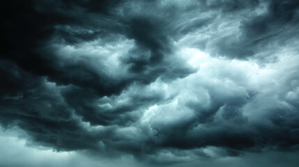 Obraz premium Dramatic storm clouds fill sky, creating moody and intense atmosphere. swirling patterns and dark shades evoke sense of impending weather changes and nature power