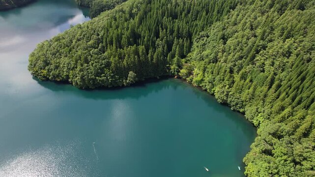 Aerial View Of Lake Aoki With Turquoise Waters And Dense Forest In Summer In Nagano, Omachi, Japan.