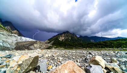 Dramatic Landscape: Lightning Strikes Over Rocky Mountain Valley Amidst Stormy Skies
